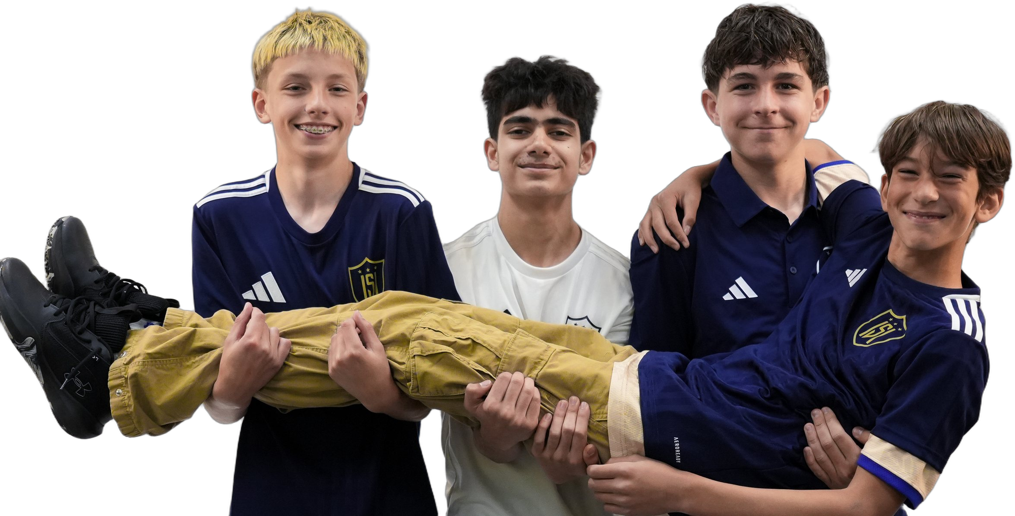 Four ISI Academy players grinning at the camera as three of them carry the fourth across their arms.