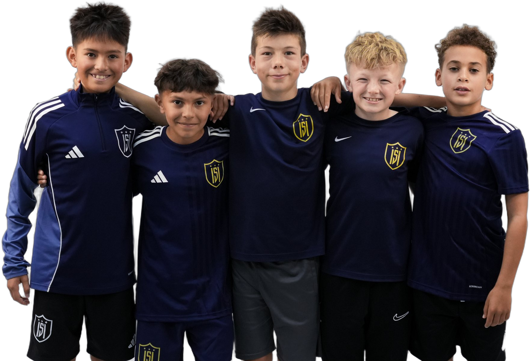 Five young ISI Academy players in navy kit, arms around each other, smiling.